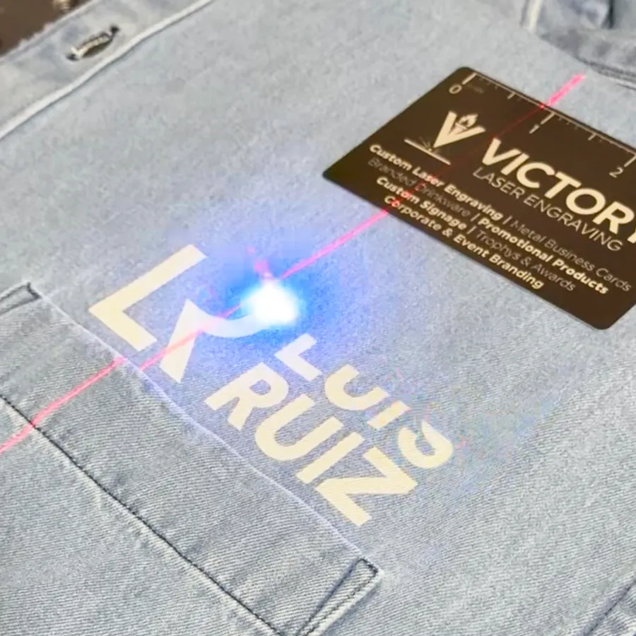 Laser engraving a custom design onto fabric apparel