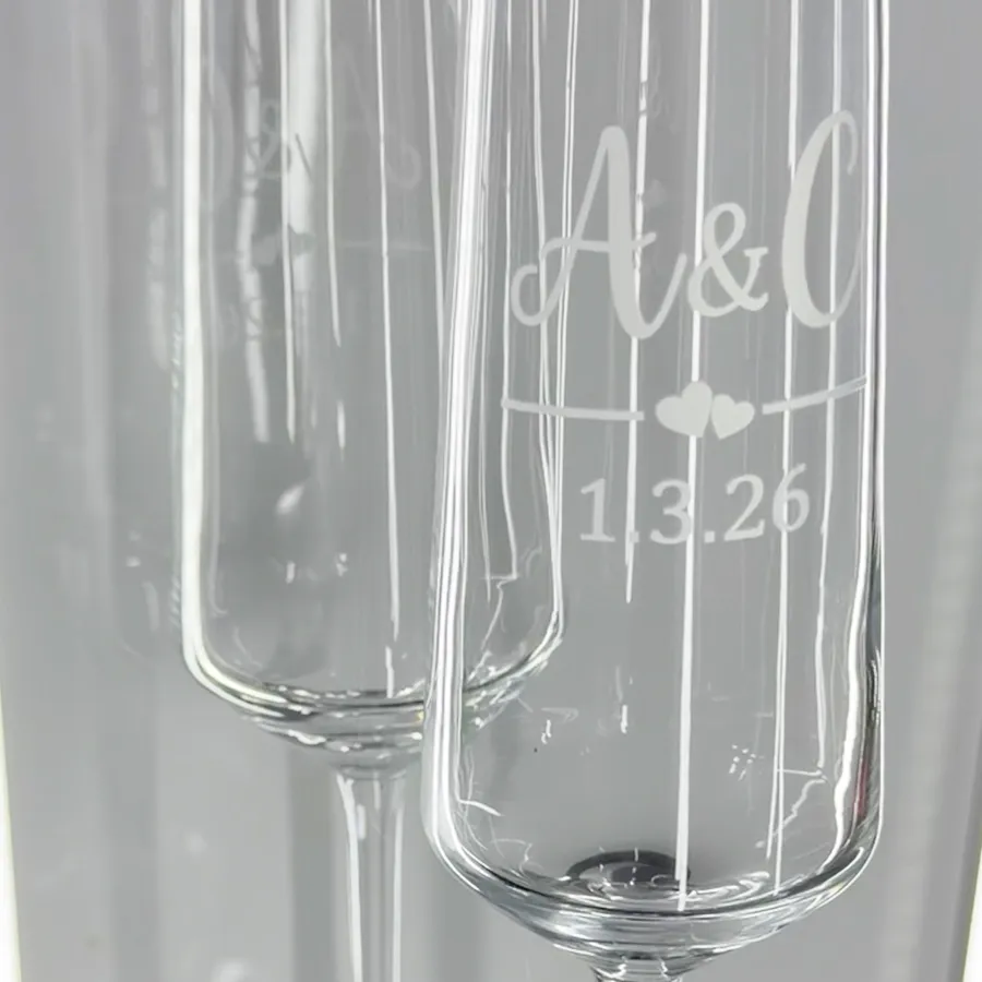 Laser engraved wedding champagne flutes on glass